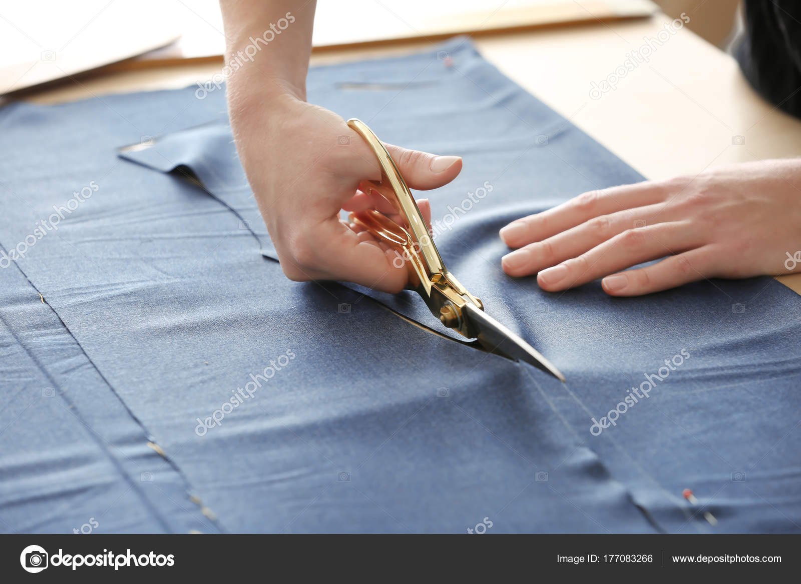 depositphotos_177083266-stock-photo-young-tailor-working-textile-closeup