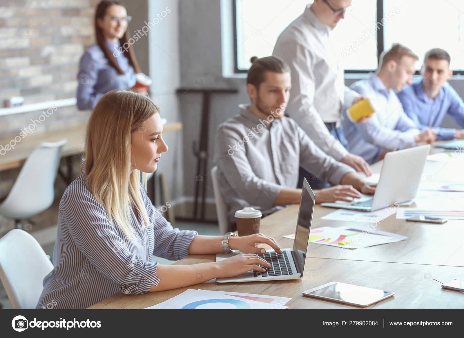 depositphotos_279902084-stock-photo-colleagues-during-business-meeting-in