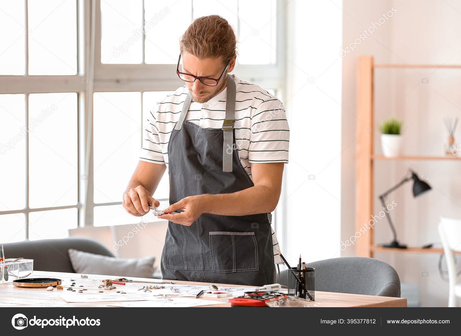 depositphotos_395377812-stock-photo-male-jewelry-designer-working-office