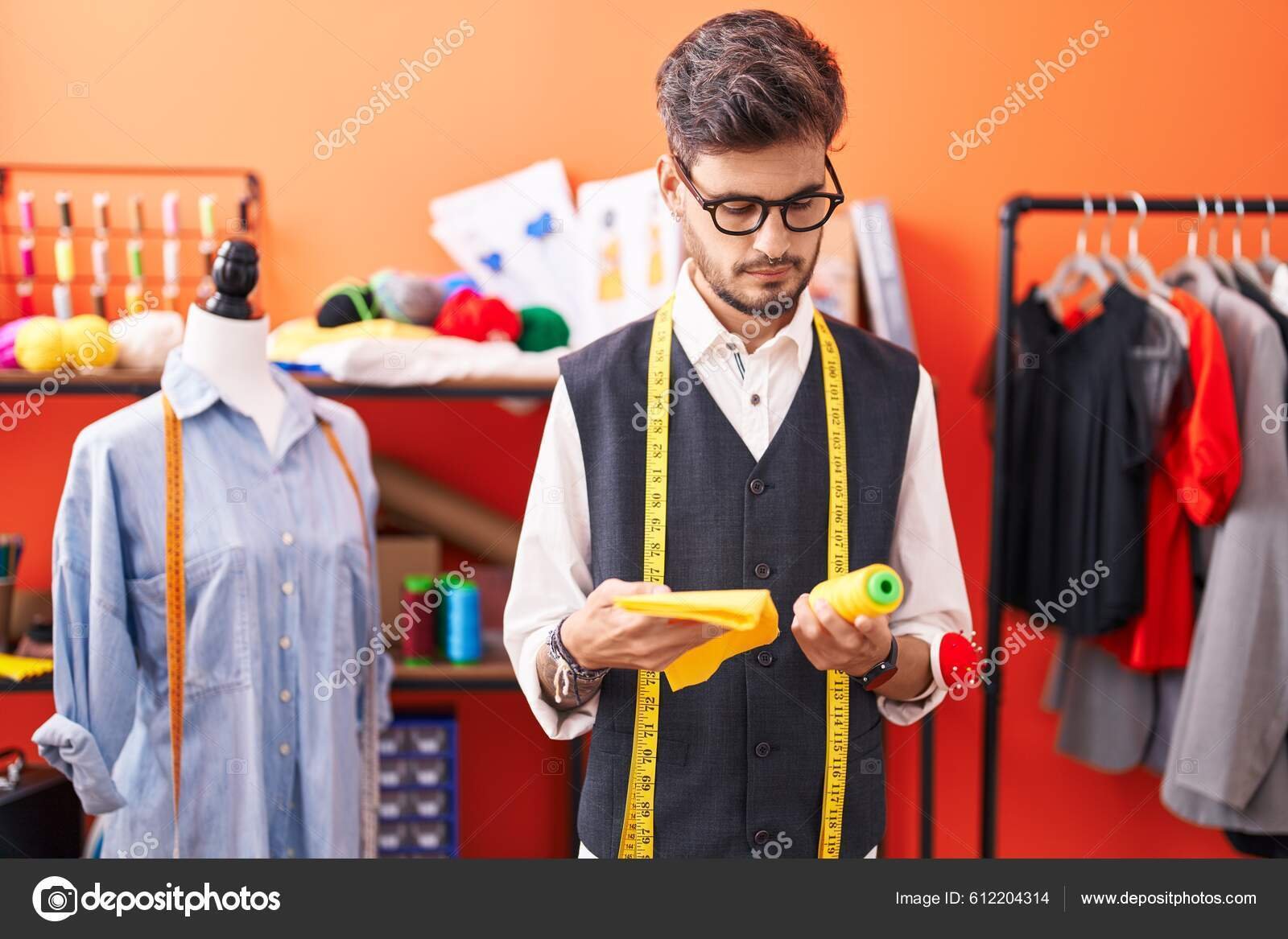 depositphotos_612204314-stock-photo-young-hispanic-man-tailor-holding