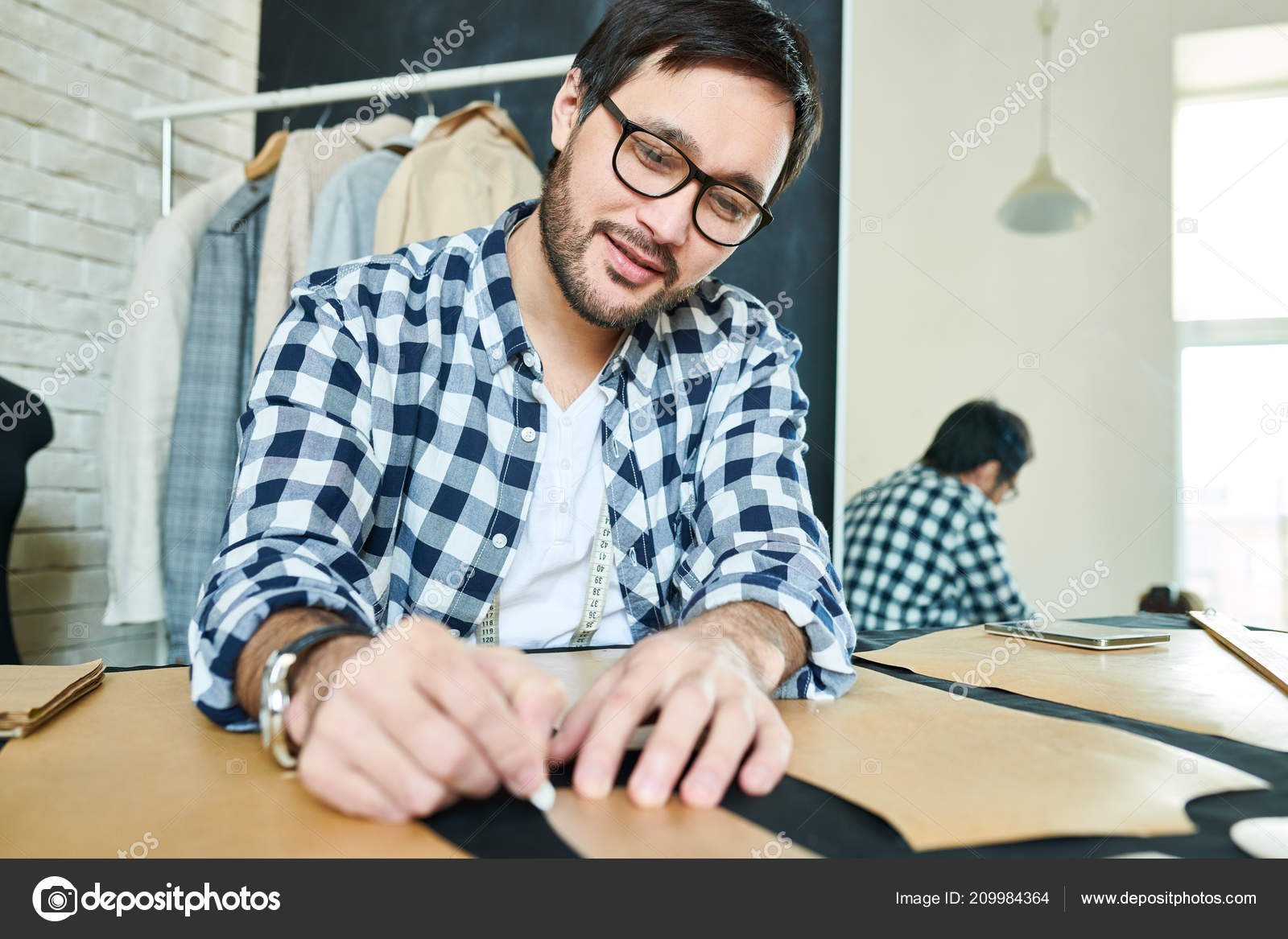 depositphotos_209984364-stock-photo-smiling-bearded-man-eyeglasses-sitting