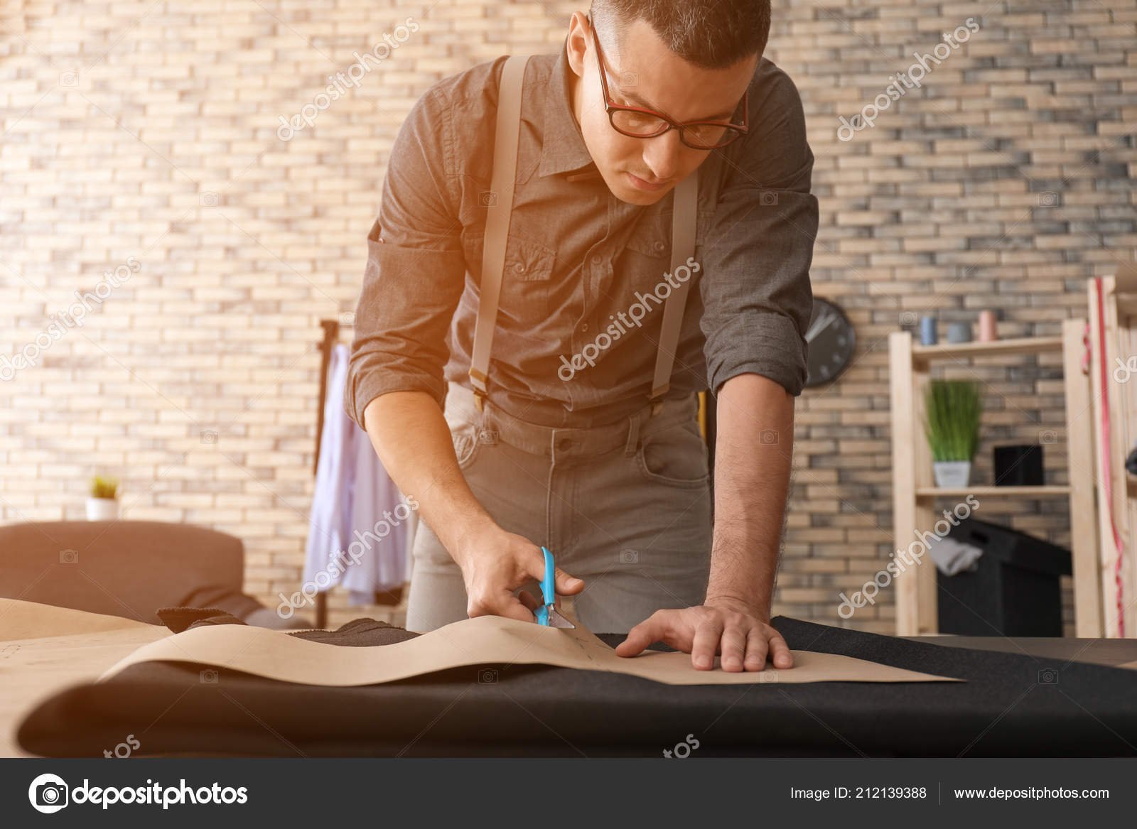 depositphotos_212139388-stock-photo-young-tailor-working-sewing-pattern
