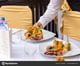 depositphotos_581692886-stock-photo-restaurant-waitress-serving-table-starter