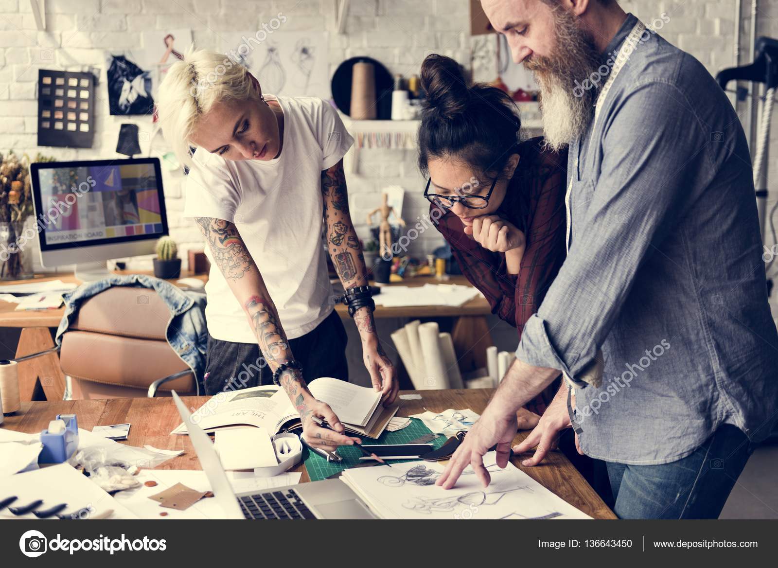 depositphotos_136643450-stock-photo-fashion-designers-working-in-showroom