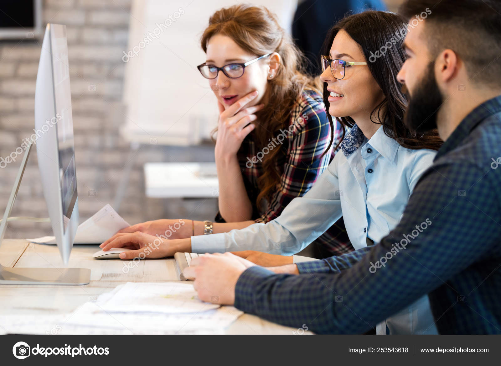 depositphotos_253543618-stock-photo-young-architects-working-on-project
