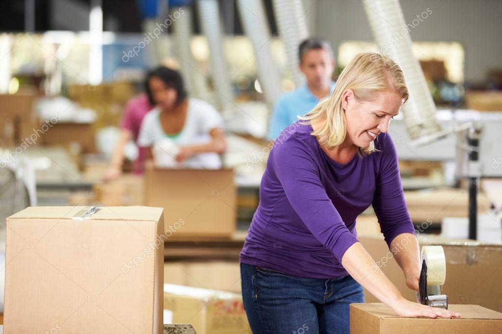 depositphotos_36835945-stock-photo-workers-in-warehouse-preparing-goods