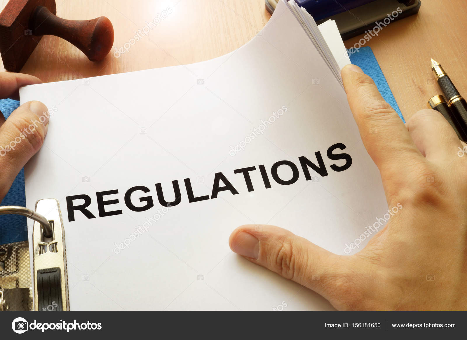 depositphotos_156181650-stock-photo-documents-with-title-regulations-on