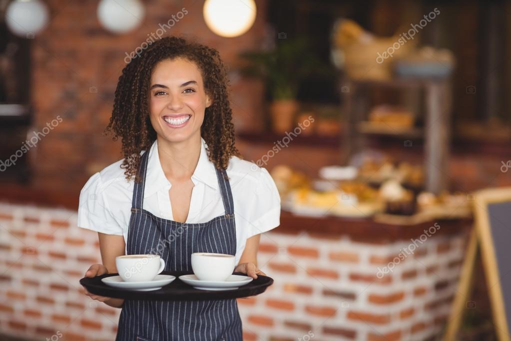 depositphotos_81820698-stock-photo-smiling-barista-holding-a-tray